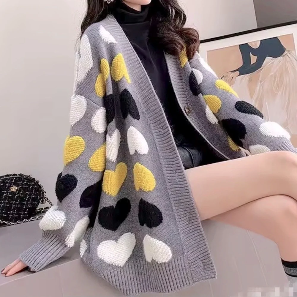 Gray button up cardigan sweater with plush heart pattern
